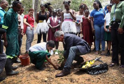 Senator the Honourable Clarence Rambharat, Minister of Agriculture, Land and Fisheries (right), assist 4-H student, Avinash Sankar (left), in planting a sugar apple tree, during a Tree Planting Ceremony held at the Royal Botanic Gardens in Port of Spain on Wednesday 3rd April, 2019. The event was hosted by the World Food Day National Committee of Trinidad and Tobago (WFDNCTT).