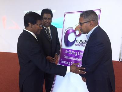 Minister of Agriculture, Land and Fisheries, Senator the Honourable Clarence Rambharat (extreme right), chats with the President of the Chaguanas Business Chamber, Mr. Vishnu Charran (extreme left) at the Cunupia Business Chamber 's Annual Dinner and Awards Function at the Chandelier Hall and Conference Centre in Chaguanas on Saturday 13th January, 2018. Looking on is the President of the Cunupia Business Chamber, Mr. Rasheed Ali (centre).