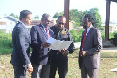 Minister of National Security Major General (Ret’d) the Honourable Edmund Dillon with Attorney General and Minister of Legal Affairs the Honourable Faris Al Rawi, Minister in the Ministry of the Attorney General and Legal Affairs the Honourable Fitzgerald Hinds and Commissioner of Prisons (Ag.) Mr. Gerard Wilson