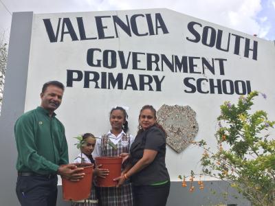 Caption: A representative of the World Food Day Committee of Trinidad and Tobago (WFDNCTT) of the Ministry of Agriculture, Land and Fisheries, Mr. Krishna Soogrim-Singh (left) is joined by 4H students – Asliyah Karim and Shauhannah Meloney – and their teacher, Ms. Cindy Jattan of the Valencia South Government Primary School. The group hold a Balata Plant after the students participated in a ‘Plant Torch’ activity from March 1st – 6th, 2017.