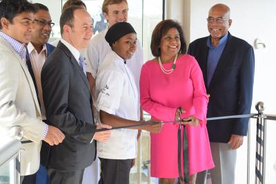 Mr Ashley Parasram T&T Fine Cocoa Company Director, His Excellency Tim Stew –British High Commissioner to Trinidad and Tobago, local chocolatiers, Trade and Industry Minister, Paula Gopee-Scoon and Mr Winston Rudder of the Cocoa Development Company cut the ribbon to open the Chocolate Box at the Hilton Trinidad and Conference Centre.