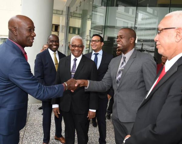 Prime Minister Dr. Rowley is greeted upon his arrival by government ministers and UDeCOTT officials.