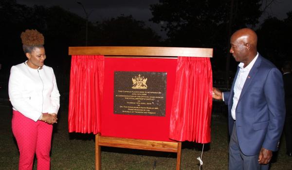 Prime Minister Dr the Honourable Keith Rowley and Minister of Community Development, Culture and the Arts, Dr the Honourable Nyan Gadsby-Dolly unveil the plaque