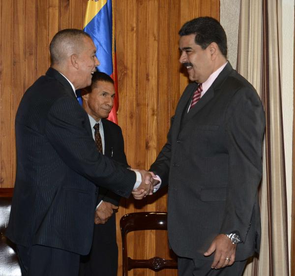 Trinidad and Tobago, His Excellency Anthony Thomas Aquinas Carmona greets Venezuelan President Nicolás Maduro Moros upon his arrival at President's House, St. Ann's.