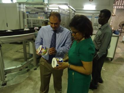 Minister examines a roll of Snuggle toilet paper